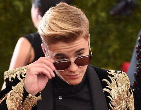 This May 5, 2015 file photo shows Justin Bieber arriving for  the Costume Institute Gala Benefit at The Metropolitan Museum of Art in New York. Pop celebrity Justin Bieber says he is developing a "futuristic" sound for "very personal" songs as he completes a long-awaited album.   The 21-year-old Canadian singer revealed that he is performing both drums and guitar on the album, on which he is collaborating with electronic producer Skrillex, legendary rap and rock producer Rick Rubin, and rap giant Kanye West.  AFP 