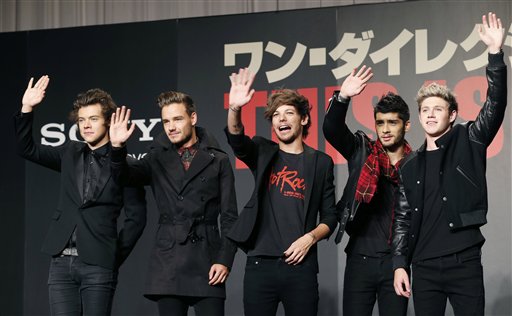FILE- In this March 25, 2015 file photo, members of One Direction, from left, Harry Styles, Liam Payne, Louis Tomlinson, Zayn Malik and Niall Horan, wave during an event to promote their film "One Direction: This Is US," in Makuhari, near Tokyo. A British newspaper has reported Monday, Aug. 24, 2015, the band members would go separate ways after finishing a tour this autumn and promoting their fifth album. Publicist Simon Jones says he wont comment on speculation that the group will take a hiatus starting in March. (AP Photo/Koji Sasahara, File)