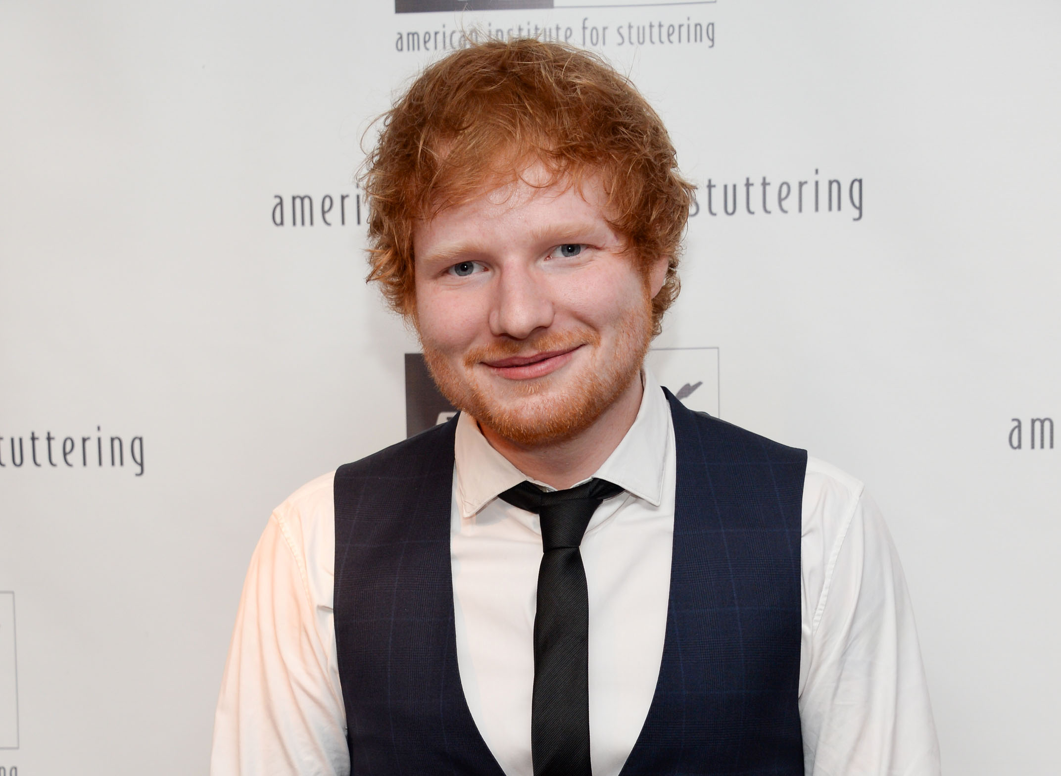 FILE - In this June 8, 2015 file photo, musician Ed Sheeran attends the American Institute for Stuttering's 9th Annual Freeing Voices Changing Lives Gala in New York. Sheeran topped Spotify’s list of the top 25 most influential artists under the age of 25 as the company’s most streamed artist of 2014. The music streaming service released their list on Tuesday, Aug. 18, 2015, which had Ariana Grande, Sam Smith, Miley Cyrus and One Direction rounding out the top five young artists.  (Photo by Evan Agostini/Invision/AP, File)