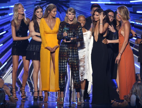 Taylor Swift accepts the award for video of the year for “Bad Blood" at the MTV Video Music Awards at the Microsoft Theater on Sunday, Aug. 30, 2015, in Los Angeles. Pictured from left are Martha Hunt, Hailee Steinfeld, Gigi Hadid, Serayah, Lily Aldridge, and Karlie Kloss. (Photo by Matt Sayles/Invision/AP)