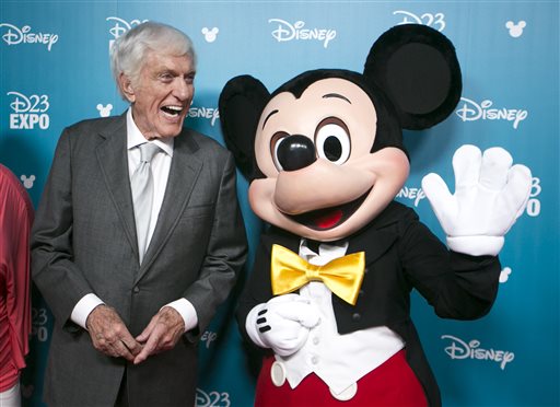 Actor and Disney Legend Dick Van Dyke, left, jokes with a Mickey Mouse cast member at Disney's D23 Expo, a fan convention on Friday, Aug. 14, 2015, in Anaheim, Calif. Van Dyke was inducted as a Disney Legend in 1998. The Walt Disney Company honors those who have made significant contributions to the Disney legacy by naming them Disney Legends.  (AP Photo/Damian Dovarganes)