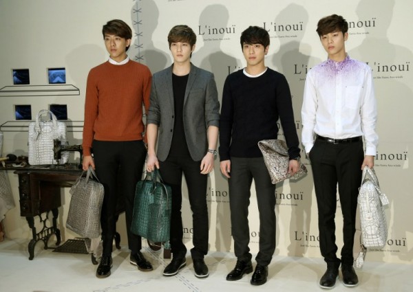 This photo taken on August 31, 2013 shows South Korean pop band CNBLUE attending the opening of fashion store "L'inoui" in Seoul.  AFP FILE PHOTO/STARNEWS