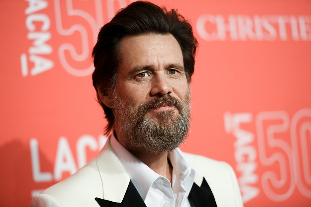 FILE - In this April 18, 2015 file photo, Jim Carrey arrives at LACMA's 50th Anniversary Gala in Los Angeles. Carrey says he was shocked and saddened to learn of the death of ex-girlfriend Cathriona White, likening the news to being hit by a lightning bolt. The 30-year-old makeup artist was found dead in her Sherman Oaks apartment on Monday, Sept. 28, according to the Los Angeles County Coroner’s Office. Her death is being investigated as a possible suicide in the ongoing case with an examination scheduled for Wednesday.  (Photo by Richard Shotwell/Invision/AP, File)
