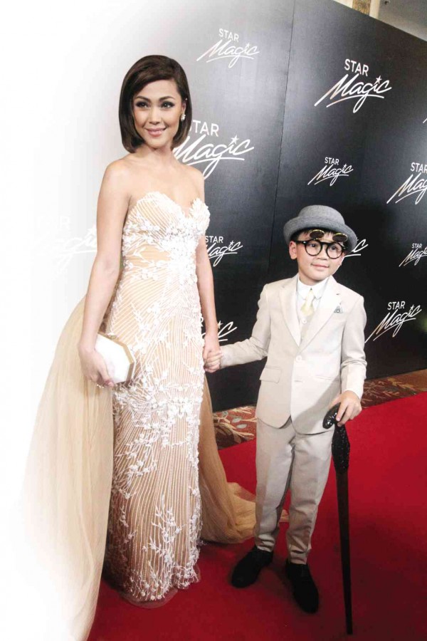 MOMMY’S LITTLE DATE Jodi Sta. Maria, in a Hannah Kong gown, walked the red carpet with son Thirdy at the Star Magic Ball. RICHARD REYES