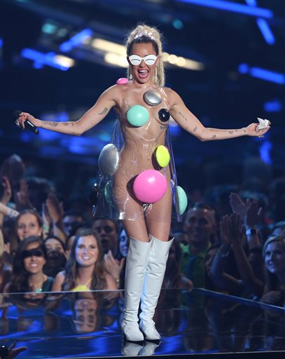 Host Miley Cyrus appears at the MTV Video Music Awards at the Microsoft Theater on Sunday, Aug. 30, 2015, in Los Angeles. (Photo by Matt Sayles/Invision/AP)