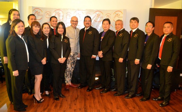 Pagcor VP for entertainment Bong Quintana (middle in mocha jacket and flowery pants) and CF Angeles City branch manager Redentor Rivera (middle with moustache) and the rest of CF Angeles City management team. CONTRIBUTED PHOTO