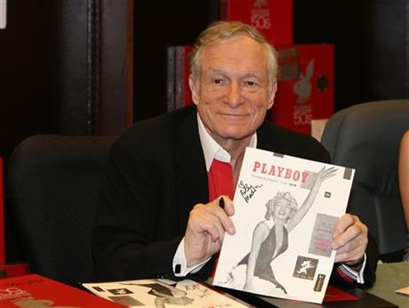  In this Nov. 15, 2007 photo, Hugh Hefner smiles while signing copies of the Playboy calendar and Playboy Cover To Cover: The 50's DVD box set in Los Angeles. Playboy will no longer publish photos of nude women as part of a redesign of the decades-old magazine, according to a news report Monday, Oct. 12, 2015. Executives for the magazine company told The New York Times that the change will take place in March 2016. Playboy editor Cory Jones contacted founder and current editor in chief Hugh Hefner recently about dropping nude photos from the print edition and he agreed, the Times reported. 