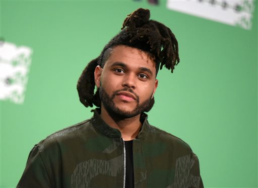 In this Aug. 30, 2015 file photo, The Weeknd poses in the press room at the MTV Video Music Awards in Los Angeles. The Canadian R&B artist known as The Weeknd has pleaded no contest to punching a Las Vegas police officer in a hotel scuffle in January. Defense attorney Shane Emerick declined comment Monday, Oct. 26, 2015, about Abel Tesfaye’s no contest plea last Wednesday to a misdemeanor battery charge.  (Photo by Richard Shotwell/Invision/AP, File)