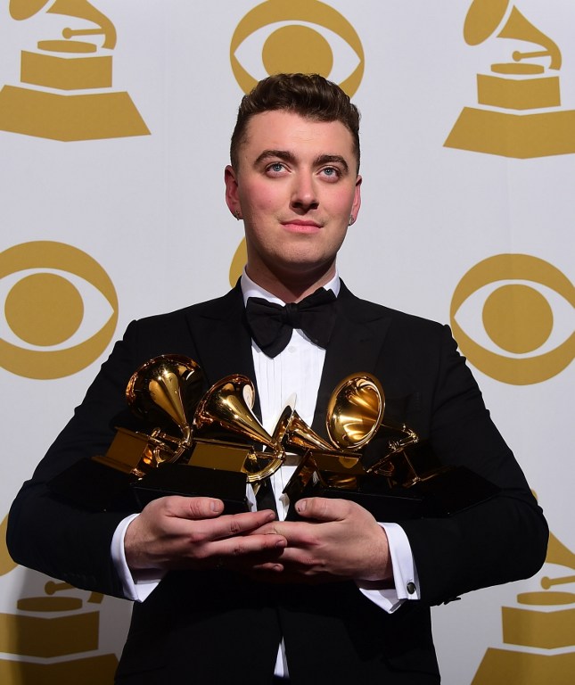 (FILES) In this February 8, 2015 file photo, Grammy winner Sam Smith, poses in the press room after performing on stage during the 57th annual Grammy Awards in Los Angeles, California.  Sam Smith was by some measures last year's biggest breakthrough musician but on his latest song he is sadder than ever. Smith returns to his familiar subject matter of fleeting love on "Drowning Shadows," a previously unreleased song that will appear on a deluxe edition of his blockbuster album "In The Lonely Hour" that comes out November 6. AFP PHOTO  /  FREDERIC J. BROWN