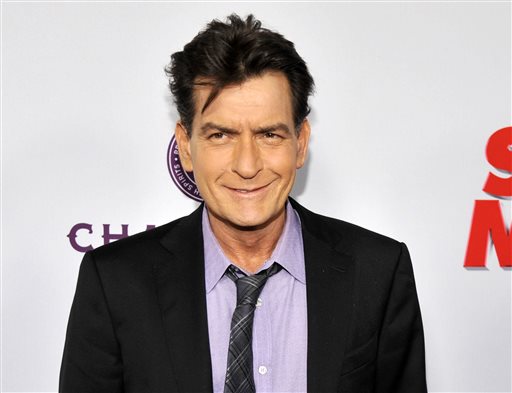 FILE - In this April 11, 2013 file photo, Charlie Sheen, a cast member in "Scary Movie V," poses at the Los Angeles premiere of the film at the Cinerama Dome in Los Angeles. Sheen is set to “make a revealing personal announcement” on NBC’s “Today” show on Tuesday, Nov. 17, 2015, NBC announced on Monday. (Photo by Chris Pizzello/Invision/AP, file)