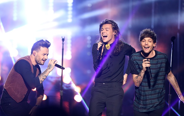 Liam Payne, from left, Harry Styles, and Louis Tomlinson of One Direction perform at the American Music Awards at the Microsoft Theater on Sunday, Nov. 22, 2015, in Los Angeles. (Photo by Matt Sayles/Invision/AP)