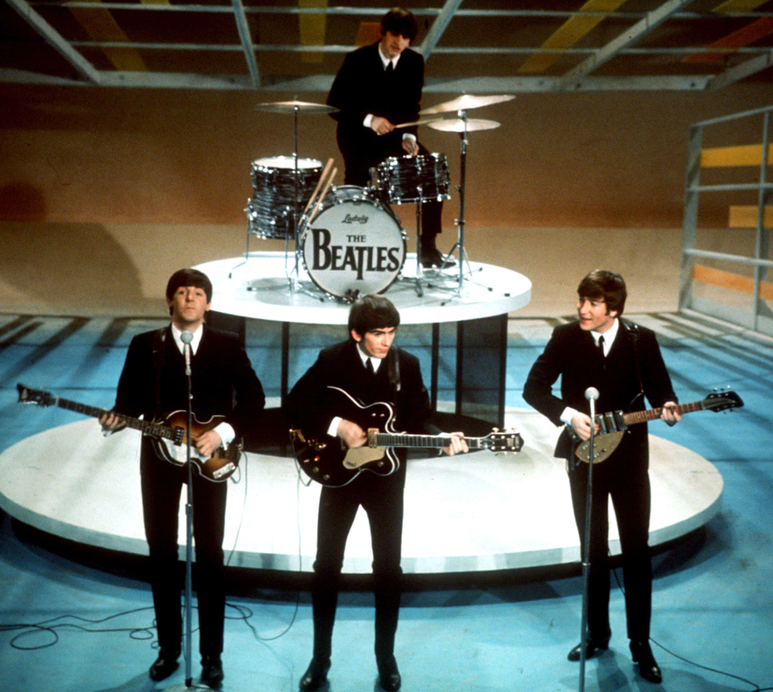 FILE - In this Feb. 9, 1964 file photo, The Beatles perform on the CBS "Ed Sullivan Show" in New York. They love us, yeah! yeah! yeah! At 12:01 a.m. local time on Dec. 24, 2015, around the world, the Beatles' music will be available for streaming from a wide range of outlets, a representative announced Wednesday, Dec. 23. (AP Photo, File)
