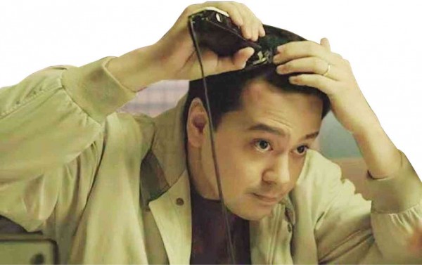 John Lloyd Cruz shaves his head in a scene from “Honor Thy Father.”