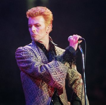 FILE - In this Jan. 9, 1997, file photo, David Bowie performs during a concert celebrating his 50th birthday, at Madison Square Garden in New York. Bowie, the innovative and iconic singer whose illustrious career lasted five decades, died Monday, Jan. 11, 2016, after battling cancer for 18 months. He was 69. (AP Photo/Ron Frehm, File)