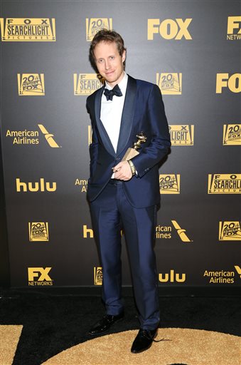 Laszlo Nemes poses with his award for best motion picture - foreign language for “Son of Saul” at the FOX Golden Globes afterparty on Sunday, Jan. 10, 2016, at the Beverly Hilton Hotel in Beverly Hills, Calif. (Photo by Omar Vega/Invision/AP)