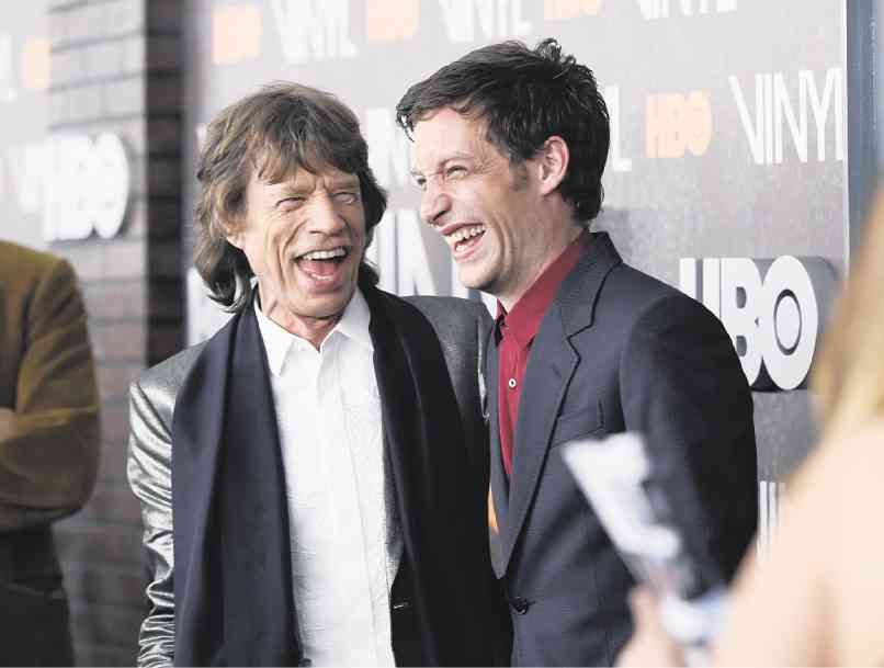 MICK Jagger (left) and son James     AP