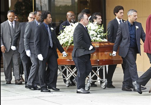 Pallbearers carry the casket of Natalie Cole after funeral services at West Angeles Church of God in Christ in the Crenshaw district of Los Angeles, Monday, Jan. 11, 2016. The Rev. Jesse Jackson follows at far left. The R&B singer Cole died on New Year's eve at age 65. AP PHOTO