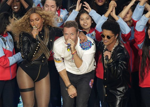 Beyoncé, Coldplay singer Chris Martin, and Bruno Mars perform during halftime of the NFL Super Bowl 50 football game Sunday, Feb. 7, 2016, in Santa Clara, Calif. (AP Photo/Charlie Riedel)