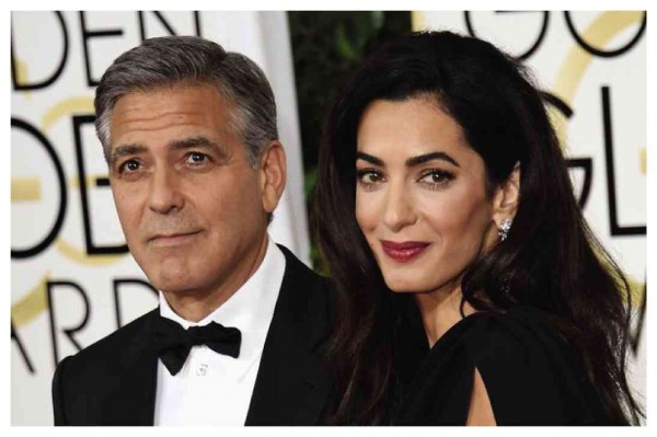 GEORGE Clooney and wife Amal               AFP