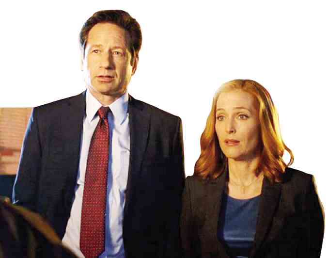 DAVID Duchovny as Fox Mulder and Gillian Anderson as Dana Scully