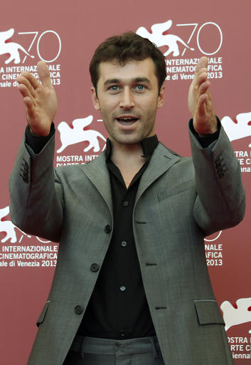 FILE - In this Aug. 30, 2013 file photo, actor James Deen poses at photo call for the film "The Canyons" at the Venice Film Festival in Venice, Italy. California has cited a movie company owned by porn star Deen, whose real name is Bryan Sevilla, for failing to use condoms on a film shoot, potentially exposing actors to hepatitis B and HIV. The state Division of Occupational Safety and Health (Cal/OSHA) on Wednesday, March 9, 2016 cited Los Angeles-based Third Rock Productions for nine violations, some considered serious, and proposed nearly $78,000 in fines. (AP Photo/David Azia, File)
