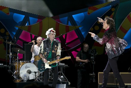 Mick Jagger, right, of the The Rolling Stones performs as Keith Richards plays the guitar and Charlie Watts plays the drums, in Havana, Cuba, Friday March 25, 2016. The Stones are performing in a free concert in Havana Friday, becoming the most famous act to play Cuba since its 1959 revolution.(AP Photo/Enric Marti)