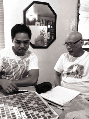 ARMANDO “Bing” Lao (right) using a scrabble game to teach principles of “found time” during one of their writing workshops.
