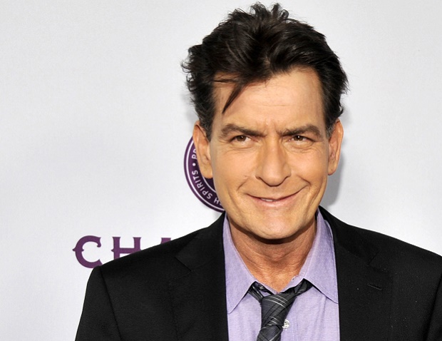FILE - In this April 11, 2013 file photo, Charlie Sheen, a cast member in "Scary Movie V," poses at the Los Angeles premiere of the film at the Cinerama Dome in Los Angeles. Los Angeles police said Wednesday, April 6, 2016, that detectives are investigating Sheen in response to a criminal report filed last week and have obtained a search warrant. The website RadarOnline reported Wednesday that the warrant was served on its operators in an attempt to obtain audio in which Sheen purportedly threatens his ex-fiancee, Scottine Ross. (Photo by Chris Pizzello/Invision/AP, file)