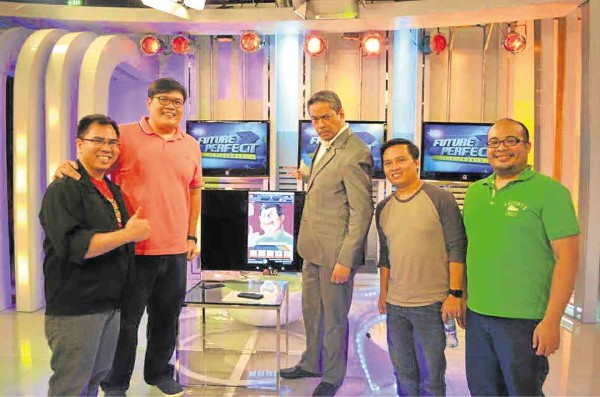 CREATORS of the  game (from left): Jimenez, Chua, Garayblas and Cruz, with TV host Tony Velasquez (center).