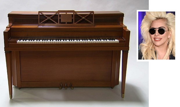 This April 5, 2016 image taken from video shows a piano owned by singer Lady Gaga in Culver City, Calif. Julien’s Auctions is offering the instrument in its "Music Icons" memorabilia sale at the Hard Rock Cafe New York. Lady Gaga’s childhood piano which she used to write her first song at age 5, didn’t hit a note at an auction in New York. The upright piano didn’t meet its reserve price Saturday, May 21, 2016,  when Los Angeles-based at Julien’s Auctions offered it as part of the “Music Icons” memorabilia sale at the Hard Rock Cafe New York. The piano had a pre-sale estimate of between $100,000 and $200,000.  (AP Photo/Rick Taber, File)