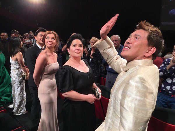Brillante Mendoza waves at the audience. Beside him are actresses Jaclyn Jose and Andi Eigenmann. Contributed photo by David Fabros