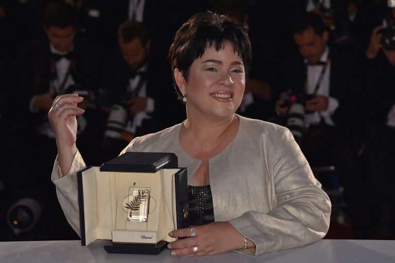 Filipina actress Jaclyn Jose poses after she was awarded with the Best Actress prize during a photocall at 69th Cannes Film Festival in Cannes, southern France,  on May 22, 2016.  / AFP PHOTO / LOIC VENANCE