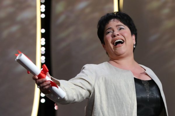 Filipino actress Jaclyn Jose celebrates on stage after being awarded with the Best Actress prize during the closing ceremony of the 69th Cannes Film Festival in Cannes, southern France, on May 22, 2016. / AFP PHOTO / Valery HACHE