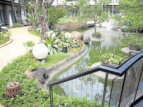 Makati hotel’s garden by the lagoon