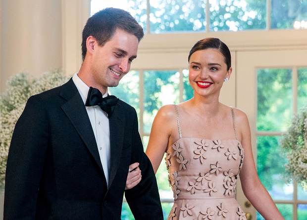In this May 13, 2016 file photo, model Miranda Kerr, right, and her boyfriend, Snapchat CEO Evan Spiegel, arrive for a state dinner for Nordic leaders at the White House in Washington. Kerr announced on her Instagram account, Wednesday, July 20, that the couple are engaged. This will be the second marriage for Kerr, who was previously married to actor Orlando Bloom. They have a 5-year-old son together named Flynn. Spiegel, 26, has never been married. AP FILE PHOTO