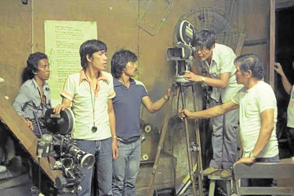 MIKE de Leon (second from right) shoots the frat headquarters scene at the LVN studio.       Cesar Hernando