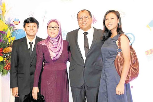 “REDHA” director Tonku Mona Riza (second from left), producer Haris Sulong, and their children.