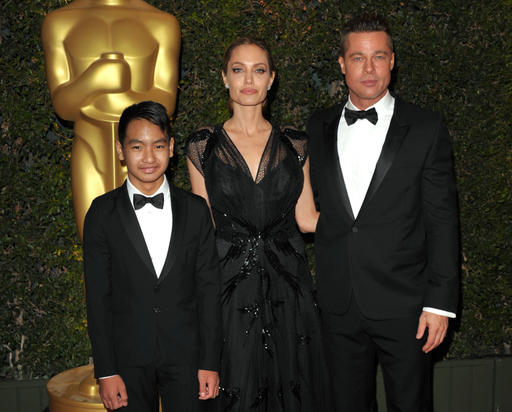 In this Nov. 16, 2013 file photo, Maddox Jolie-Pitt, from left, Angelina Jolie and Brad Pitt attend the 2013 Governors Awards in Los Angeles. Jolie Pitt filed for divorce from her husband on Sept. 19, 2016, demanding sole physical custody of their six children. AP