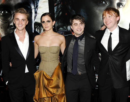 In this July 11, 2011 file photo, cast members, from left, Tom Felton, Emma Watson, Daniel Radcliffe and Rupert Grint pose together at the premiere of "Harry Potter and the Deathly Hallows: Part 2" at Avery Fisher Hall in New York. Warner Bros. said on Oct. 3, 2016, that all 8 Harry Potter films will be re-released in theaters for a one-week run beginning Oct. 13, 2016. AP