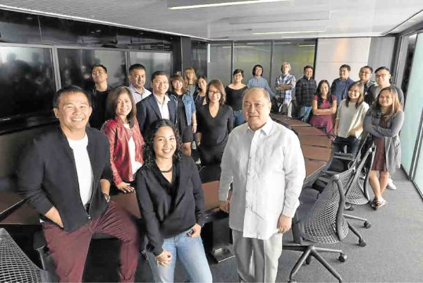 CHOT Reyes (left) and Manny V. Pangilinan (center), with the D5 Studio team