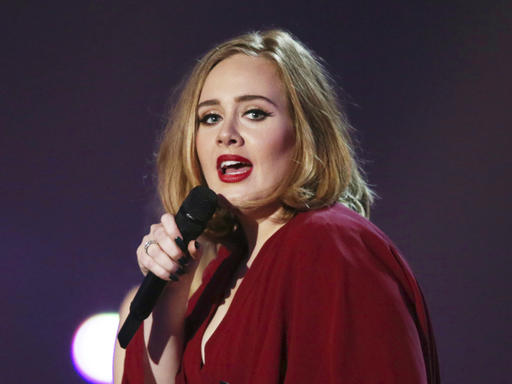 This Feb. 24, 2016 file photo shows Adele onstage at the Brit Awards 2016 at the 02 Arena in London. Adele opened up to Vanity Fair about parenting and her struggle with postpartum depression in an issue for the magazine's December 2016 issue. AP