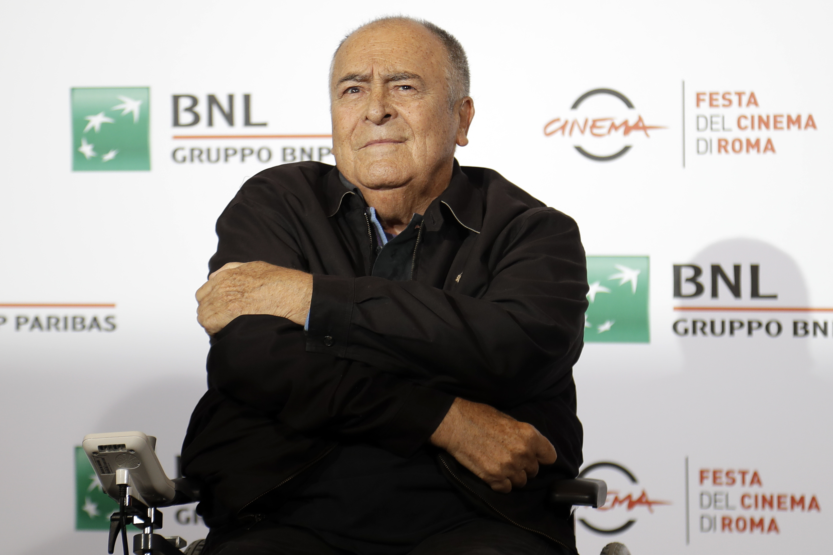 FILE - In this Oct. 15, 2016, file photo, director Bernardo Bertolucci poses for photographers during a photo call at the Rome Film festival in Rome. A recently unearthed video interview with Bertolucci from 2013 has renewed interest, and outrage, over what happened to actress Maria Schneider on set during the infamous butter sex scene in “Last Tango in Paris”. (AP Photo/Gregorio Borgia, File)