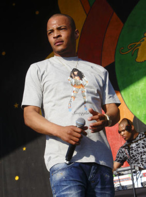 This May 2, 2015 file photo shows T. I. performing at the New Orleans Jazz & Heritage Festival in New Orleans. Motivated by the deaths of two young black men in Minnesota and Louisiana, Tip released the EP "Us or Else" which focuses on the issues of social justice and police brutality. AP