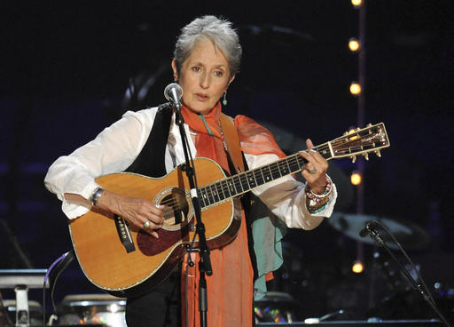 In this May 3, 2009 file photo, Joan Baez performs at a benefit concert celebrating Pete Seeger's 90th birthday at Madison Square Garden in New York. Baez, the late rapper Tupac Shakur, as well as Seattle-based rockers Pearl Jam lead a class of Rock and Roll Hall of Fame inductees that also include 1970s favorites Journey, Yes and Electric Light Orchestra. AP