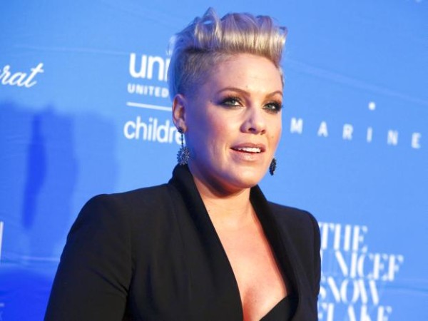 In this photo, taken Dec. 1, 2015, Pink attends the US Fund for UNICEF Snowflake Ball benefit at Cipriani Wall Street in New York. Pink and her motocross-champ husband got a bundle of joy for the holidays. The Grammy winner announced on Instagram that her second child with husband Carey Hart was born on Dec. 26, 2016. Pink posted a photo of herself cradling her newborn son, named Jameson Moon Hart. (Photo by ANDY KROPA/Invision/AP)