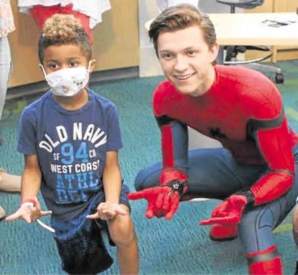 “Spider-Man” actor Tom Holland visits sick children during his spare time.