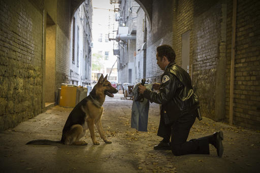 This image released by Universal Studios shows John Ortiz in a scene from "A Dog's Purpose." Marketers would describe "A Dog's Purpose" as a film with "four-quadrant" appeal, meaning it's likely to draw moviegoers of both genders, young and old. Based on a bestselling book and told from a dog's perspective, it's a feel-good story for animal lovers of all kinds. Which is why a video leaked last week of a frightened dog apparently forced into rushing water during the making of the film is so damaging to its opening box-office prospects this weekend : It alienates, even offends, its very audience.(Joe Lederer/Universal Studios via AP)