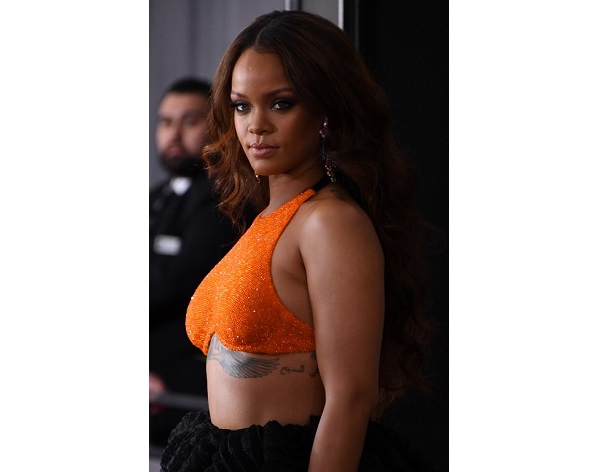 (FILES) This file photo taken on February 12, 2017 shows Rihanna arriving for the 59th Grammy Awards in Los Angeles, California.  Lovers who plan to celebrate Valentine's Day with some music in the bedroom have voted -- they do it to Rihanna. Leading streaming service Spotify marked the holiday of love February 14, 2017 by analyzing playlists described by users as songs for making love. The top choice was Rihanna's "Sex With Me," a track off her latest album "Anti" in which the sultry singer boasts of her prowess.  / AFP PHOTO / Mark RALSTON
