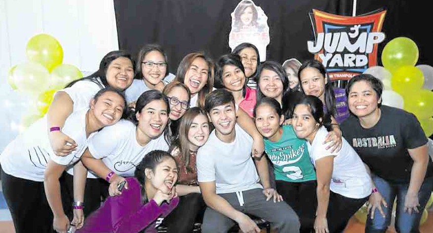 Joyce Ching and Kristoffer Martin (center) with their fans
