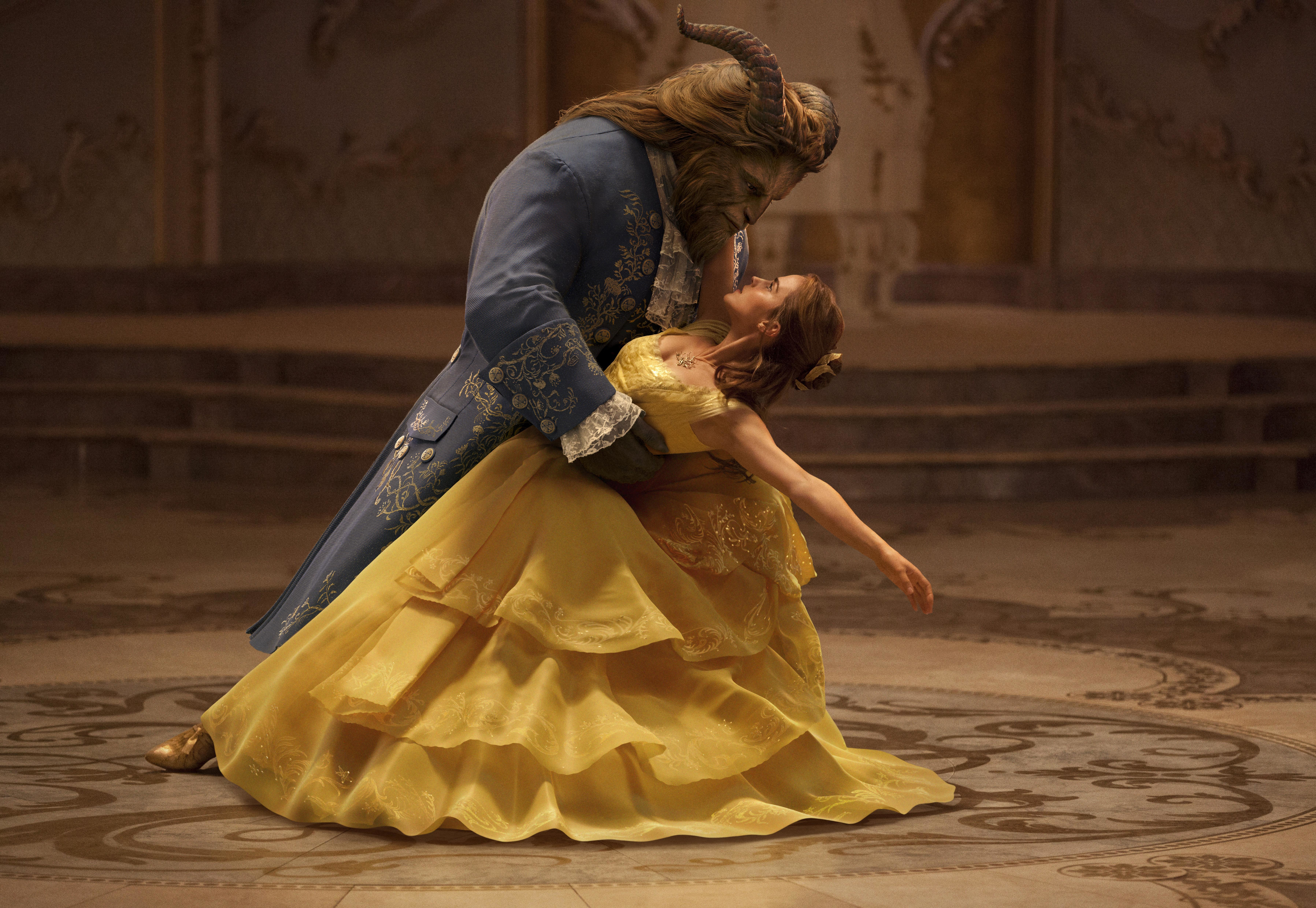 This image released by Disney shows Dan Stevens as The Beast, left, and Emma Watson as Belle in a live-action adaptation of the animated classic "Beauty and the Beast." (Disney via AP)